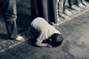 Muslim Child Praying in Mosque