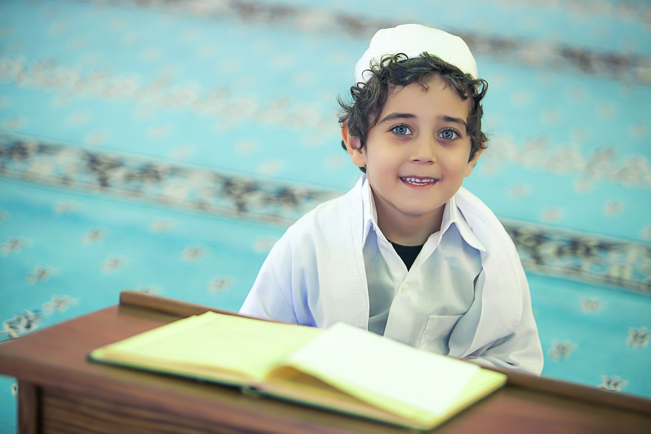 child reading Quran
