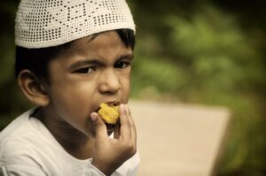 Muslim Child Eating Food