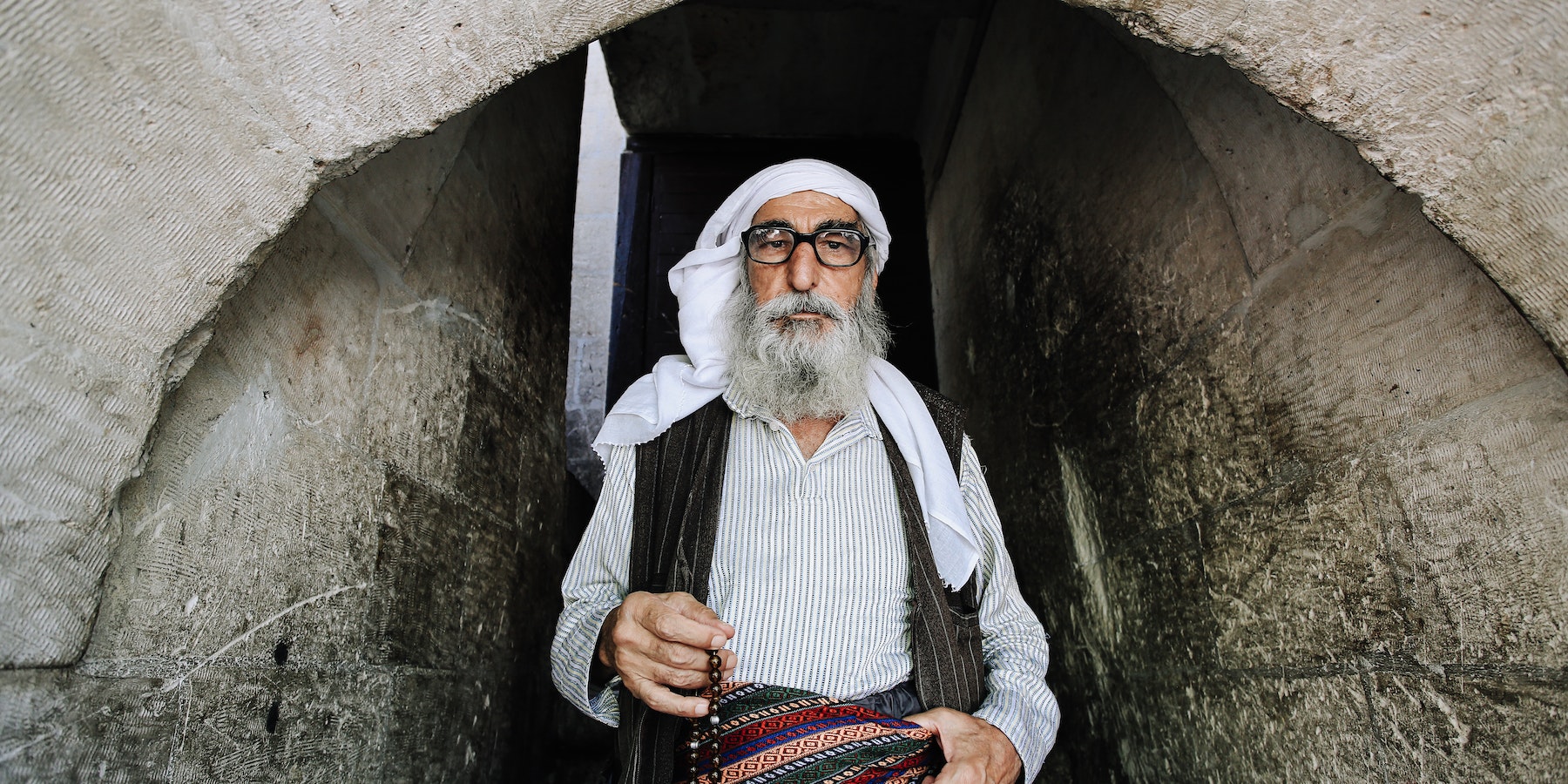 Aged Muslim Man with Rosary