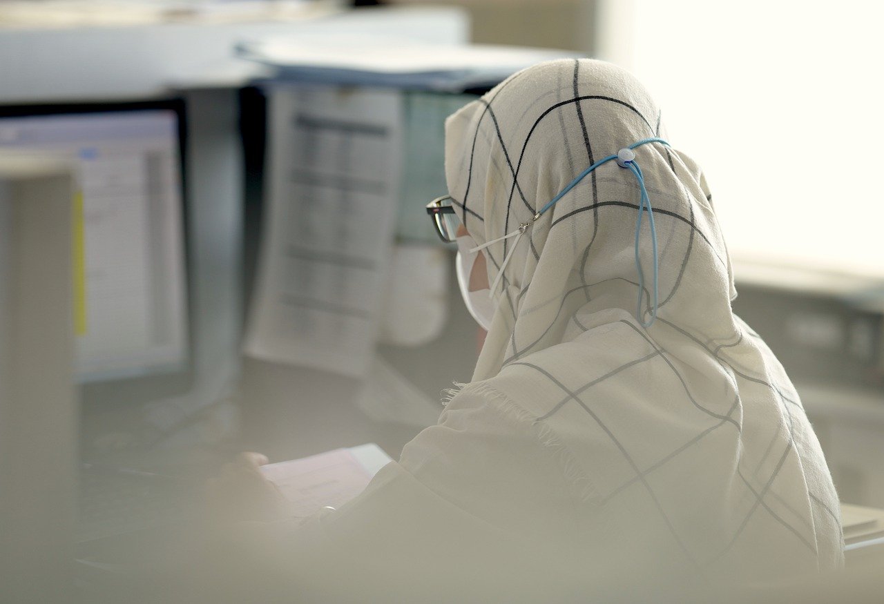 Woman Wearing White Hijab and Glasses