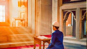 Boy offering salah in mosque