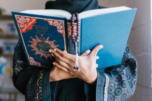 Woman Praying with Quran