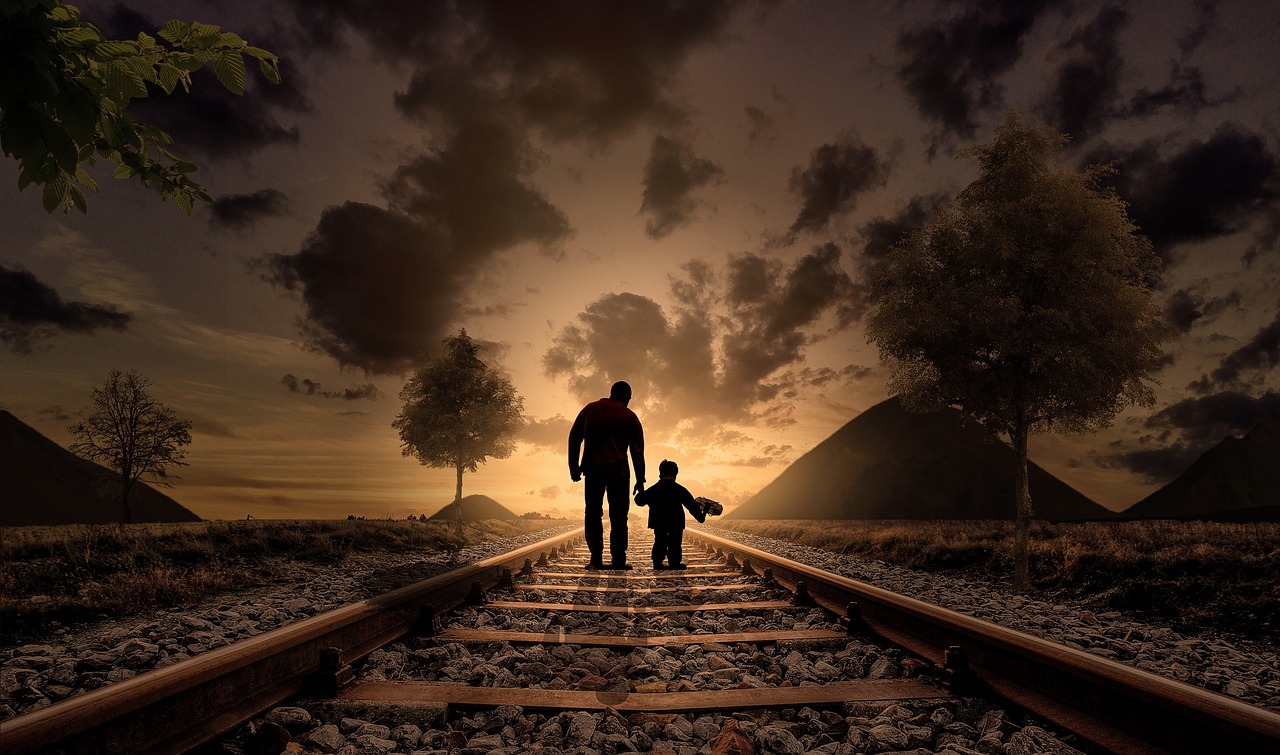 father and son holding hands