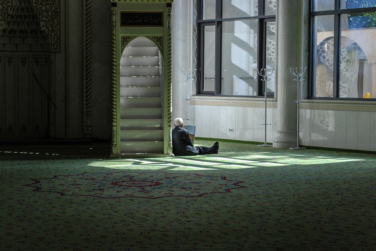 man sitting in mosque